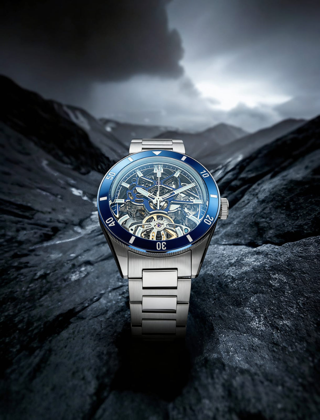 Qorum Equinox Men’s Automatic Skeleton Watch – Steel Finish Dial, Blue Bezel, Stainless Steel Strap