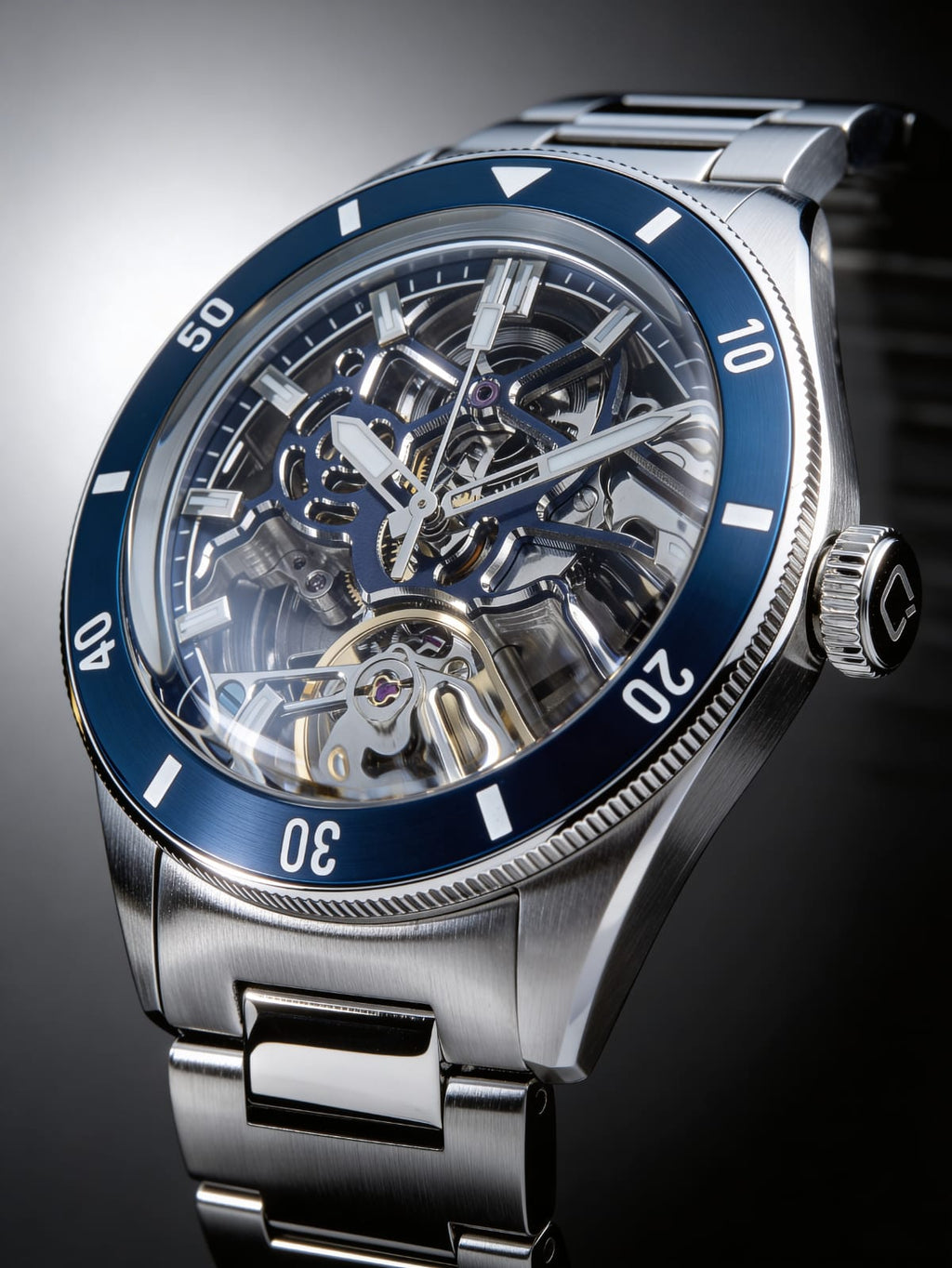 Qorum Equinox Men’s Automatic Skeleton Watch – Steel Finish Dial, Blue Bezel, Stainless Steel Strap