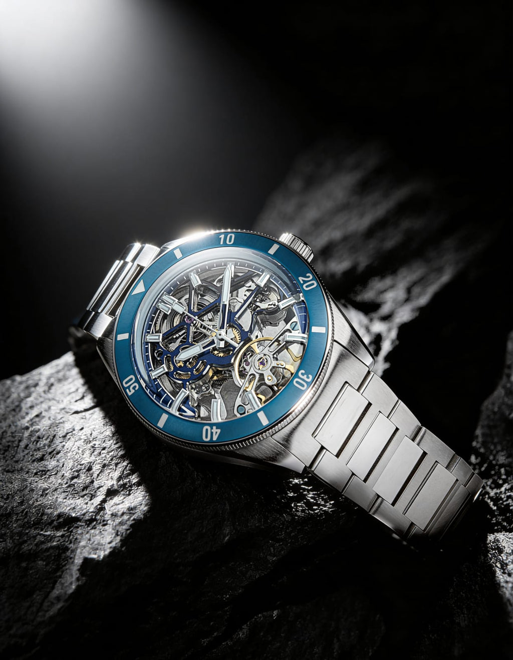 Qorum Equinox Men’s Automatic Skeleton Watch – Steel Finish Dial, Blue Bezel, Stainless Steel Strap